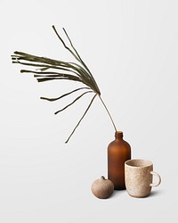 Minimal coffee cup by a brown vase