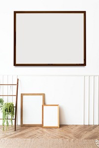 Blank picture frames by a wooden ladder