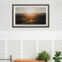 Picture frame mockup hanging on  a white and gray semicircle patterned wall