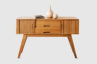 Wooden sideboard table with books and a vase 