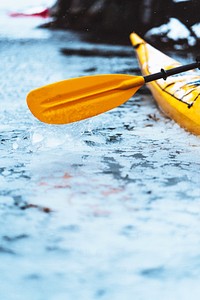 Oar of boat touching frozen water in Lofoten, Norway