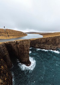 Seagull flying over the cliffs at Faroe Island