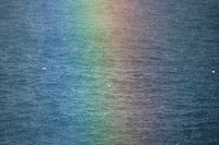 Rainbow after the rain over the Atlantic ocean in the Faroe Islands