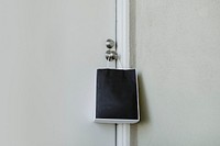 Black paper bag hanging on a door knob during the coronavirus pandemic