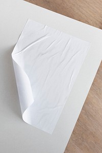 White crinkled paper on wooden background