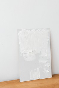 Unfinished white painting background leaning to the wall
