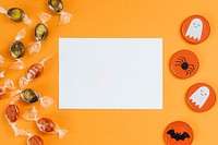 White Halloween card with copy space on an orange background 