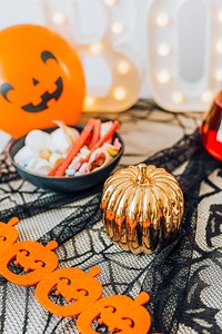 Halloween decoration with a bowl full of sugar candies 