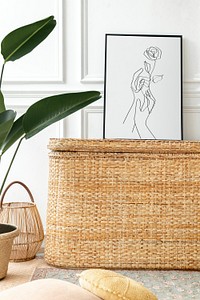 Picture frame mockup psd on a rattan chest