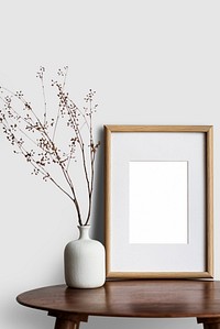 Blank tabletop picture frame on the living room&rsquo;s table