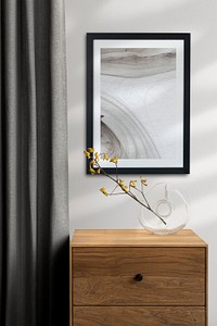 Picture frame mockup psd hanging on the wall minimal interior design