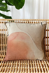 Watercolor beige printed cushion on a chair minimal interior design