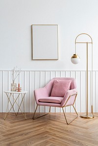 Blank picture frame by a pink velvet armchair