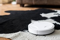 Robotic vacuum cleaner on an animal print rug  