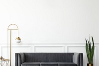 Chic mid-century modern luxury aesthetics living room with gray velvet couch and golden lamp 