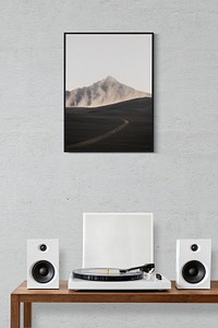 Picture frame mockup psd over a vinyl record player