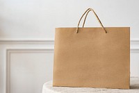 Paper shopping bag in a bright apartment