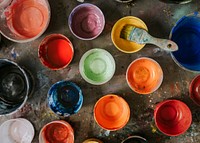 Paint mixing cup with various colors 