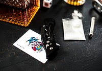 Drugs gun knife on the table 