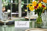Restaurant table setting service with reserved card
