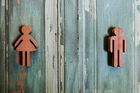 Toilet gender signs on wooden wall