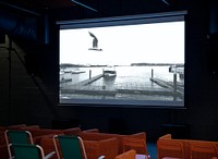 Projected screen with empty chairs