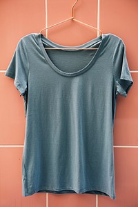 Gray tee hanging on the wall