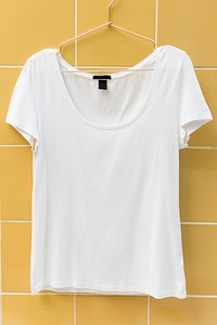 White tee hanging on the wall