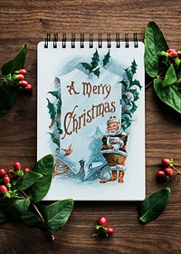 Aerial view of Christmas card on wooden table