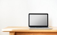 Mockup laptop on wooden table
