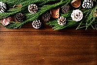 Christmas ornaments on wooden background with design space