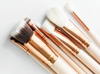 Closeup of makeup brushes on white background