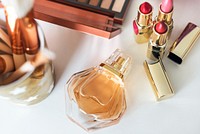 Various makeup products on white table