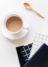 Aerial view of coffee cup with notepads