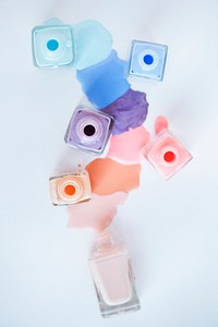 Flat lay of pastel nail polish bottles