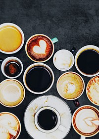 Assorted coffee cups on a textured background