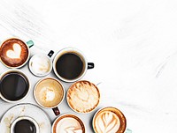 Assorted coffee cups on a textured background