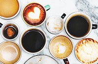 Assorted coffee cups on a marble background