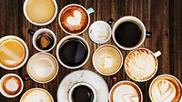 Assorted coffee cups on a wooden table