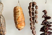Dry aged meat products hanging in a kitchen