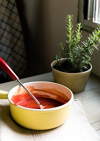 Tomato sauce in a yellow pot