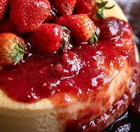 Closeup of a cheesecake topped with strawberries
