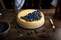 Cheesecake decorated with blueberries on a table