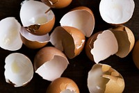 Cracked egg shells on black background