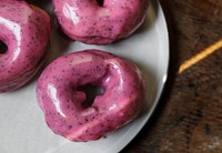 Pink glazed donuts on a plate