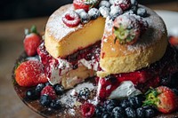 Closeup of a layered cake with berries