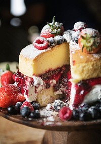 Closeup of a layered cake with berries