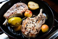 Pork chop with apples in a pan food photography recipe idea
