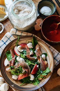 Spinach salad with parma ham and feta cheese food photography
