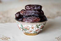 A bowl of dates on the table